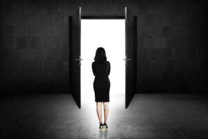 woman standing in front of open doors
